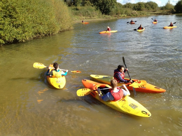 Group kayaking session on the lake
